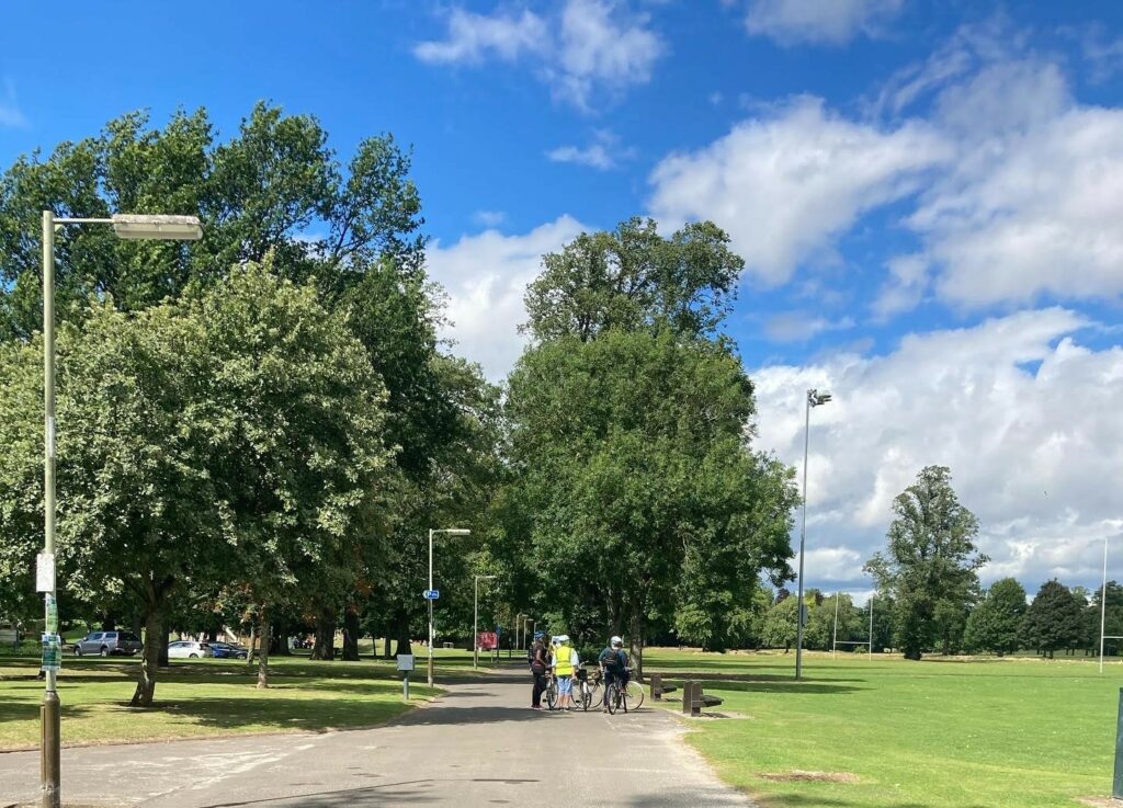 photo of cyclists at a park