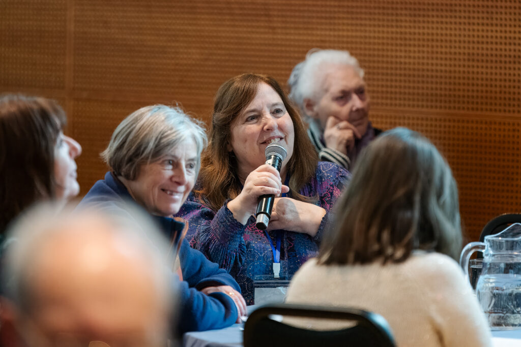 Cindy speaking at a conference